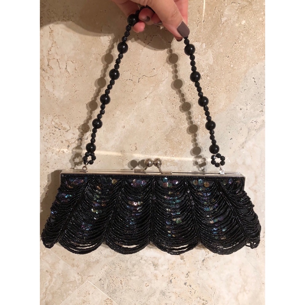 Black clutch with sequin and bead detail. NEW
